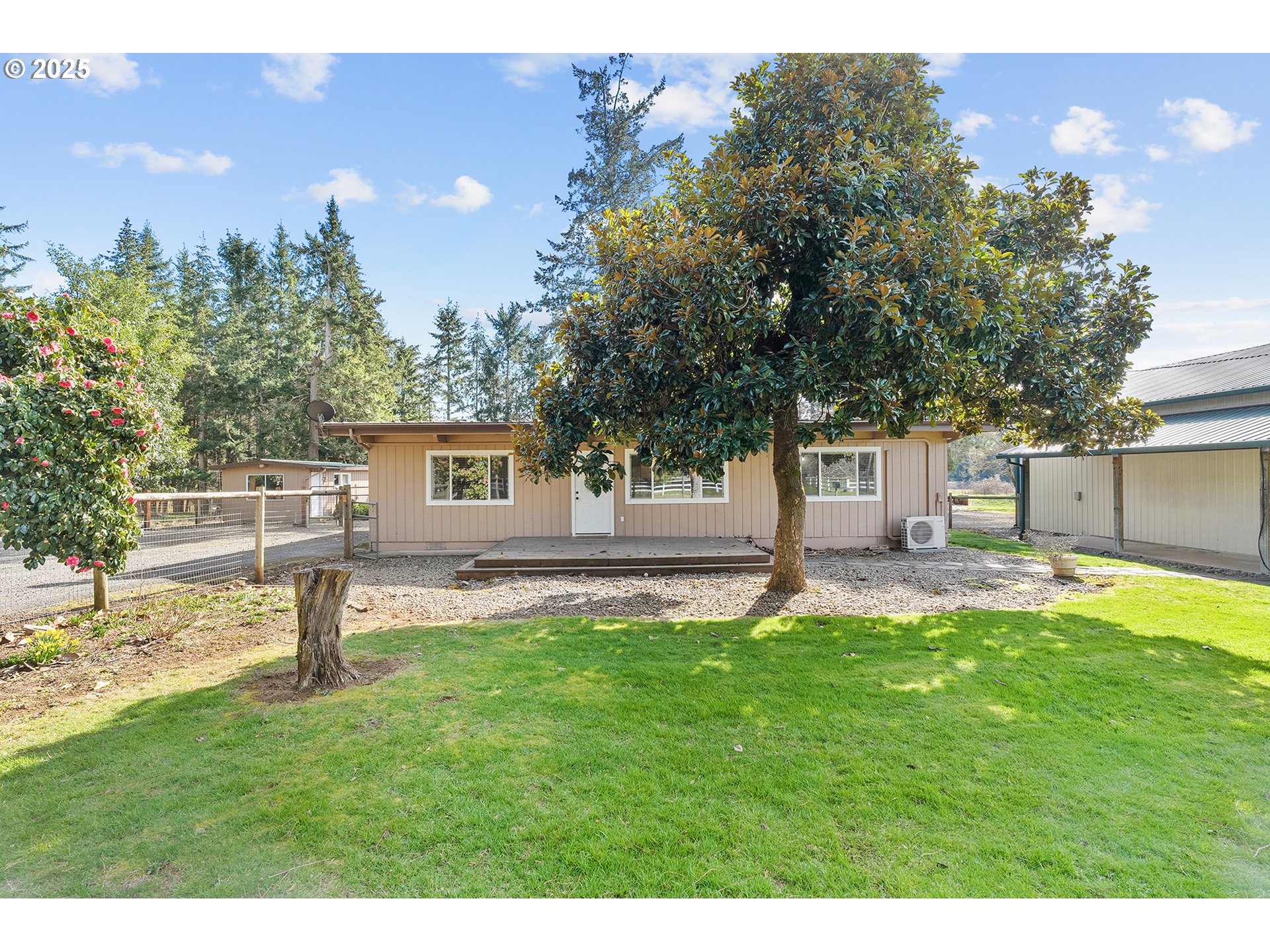 12950 South New Era Road Oregon City, OR 97045 - Photo 2 of 45 a front view of a house with a yard