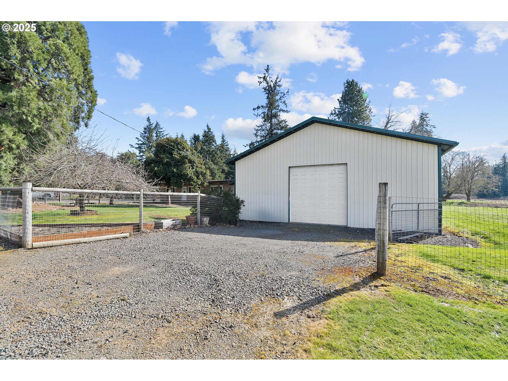 12950 South New Era Road Oregon City, OR 97045 - Photo 21 of 45 a view of a house with a yard and a large tree