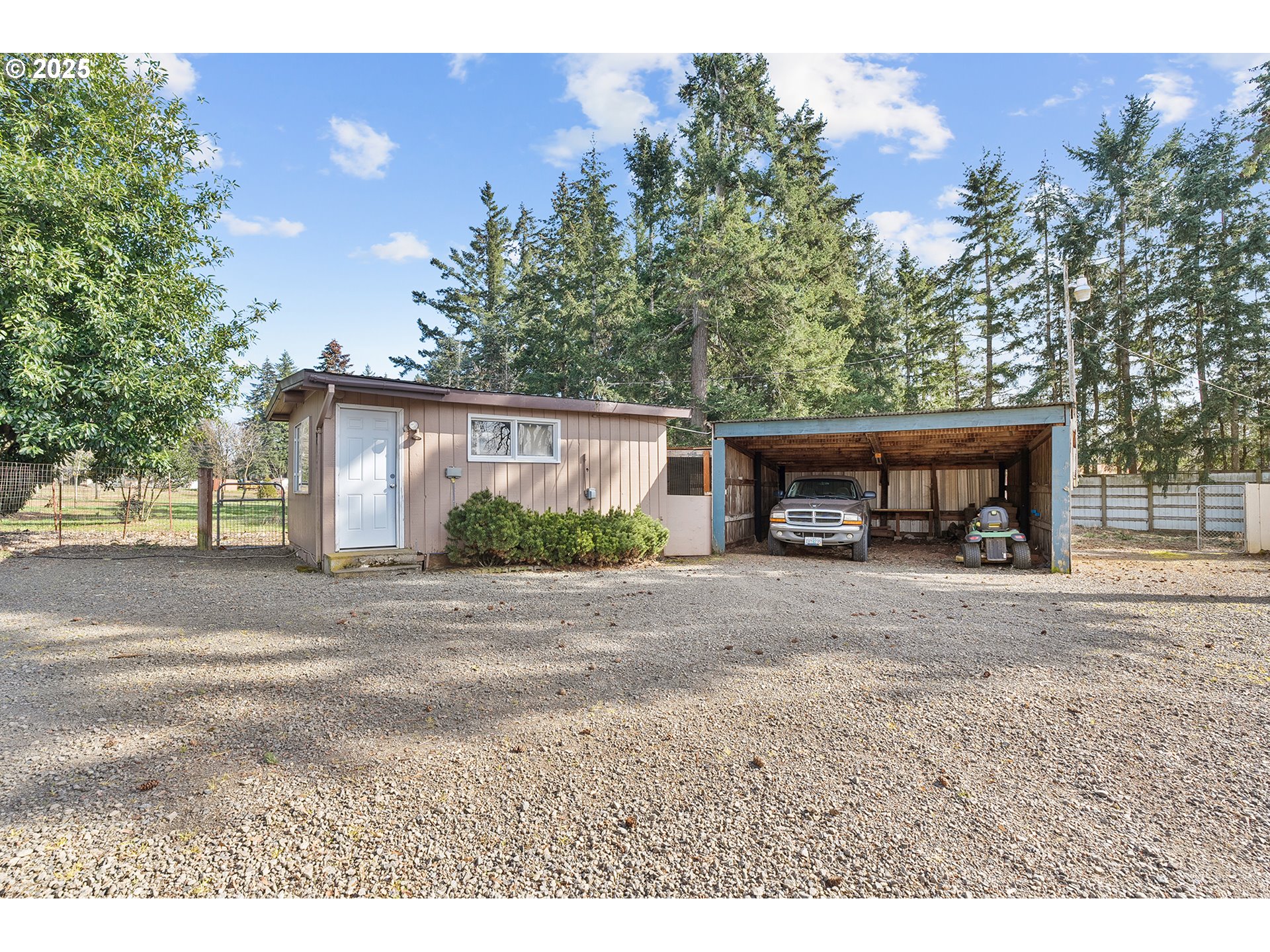 12950 South New Era Road Oregon City, OR 97045 - Photo 25 of 45 a view of a house with a yard and a garage