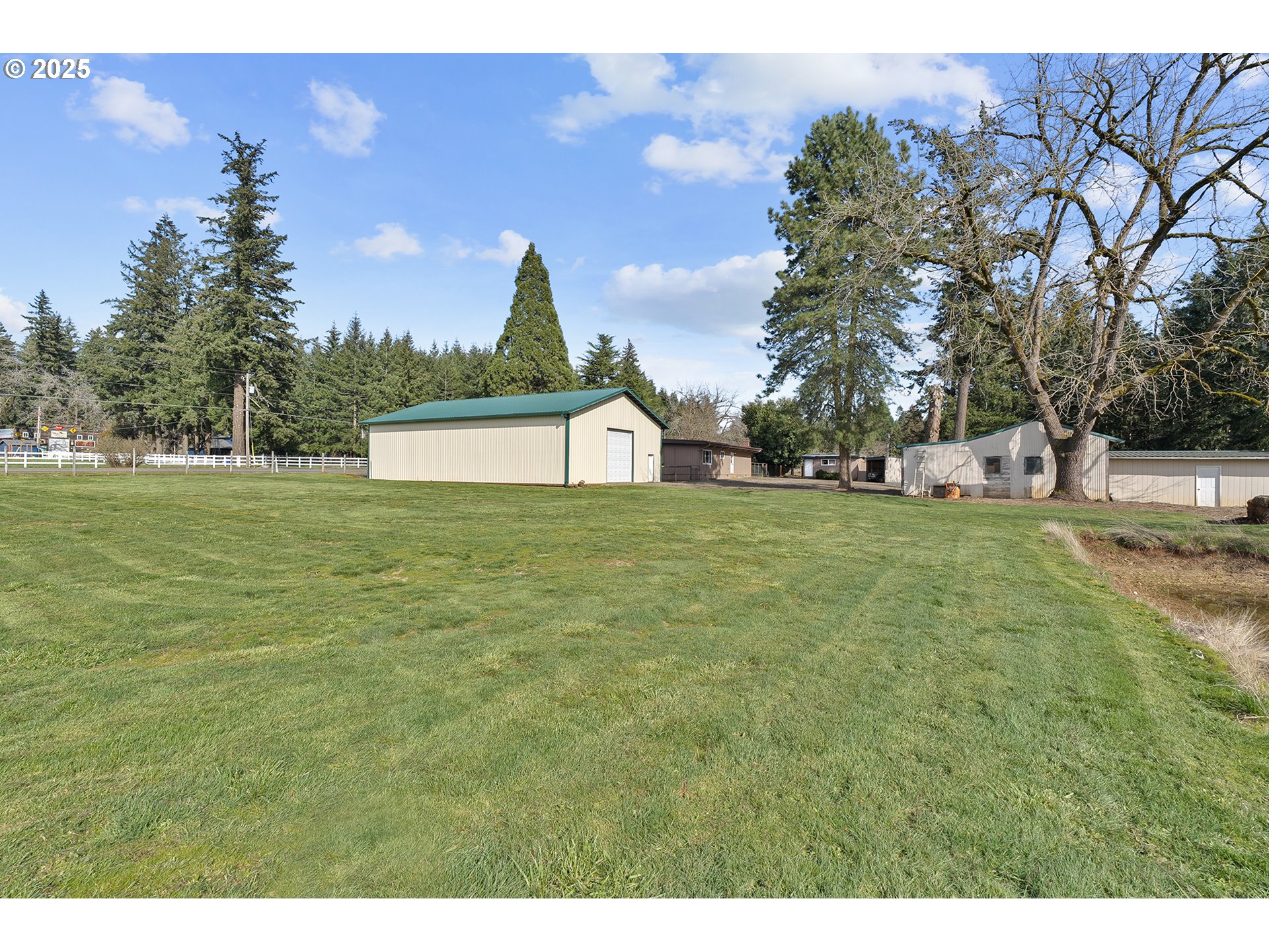 12950 South New Era Road Oregon City, OR 97045 - Photo 29 of 45 a view of a house with a yard