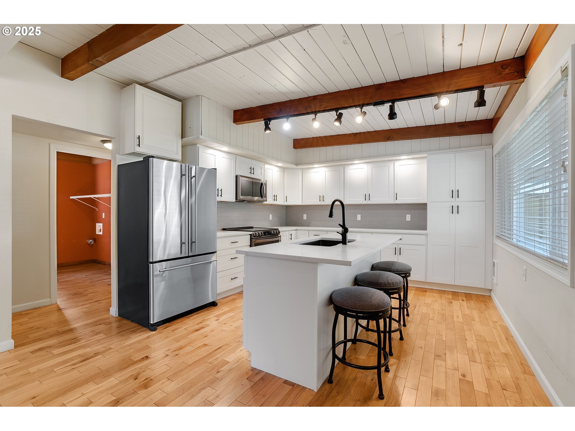 12950 South New Era Road Oregon City, OR 97045 - Photo 10 of 45 a kitchen with refrigerator and wooden cabinets