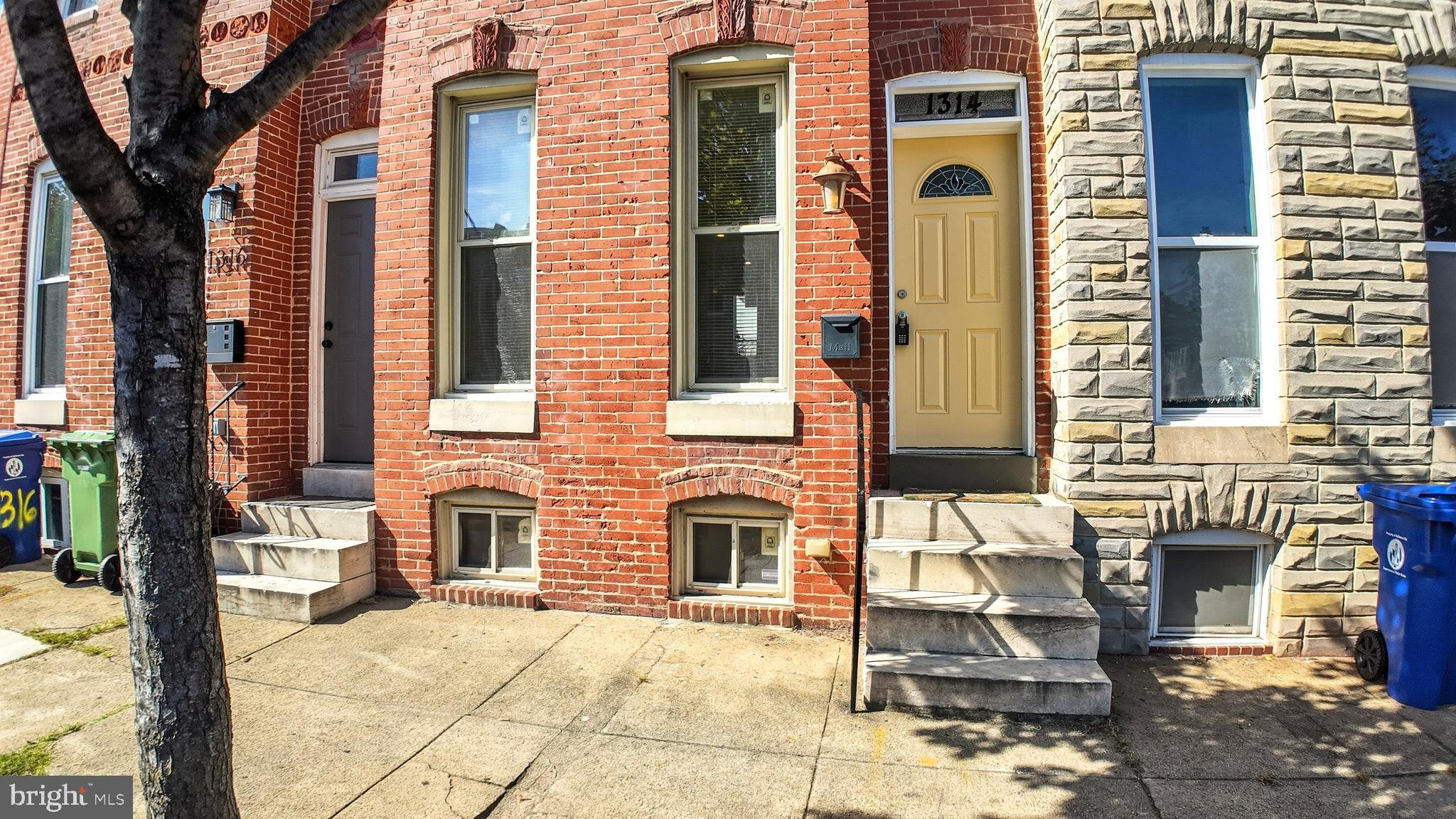 1314 James Street Baltimore, MD 21223 - Photo 2 of 19 a front view of a brick house with many windows