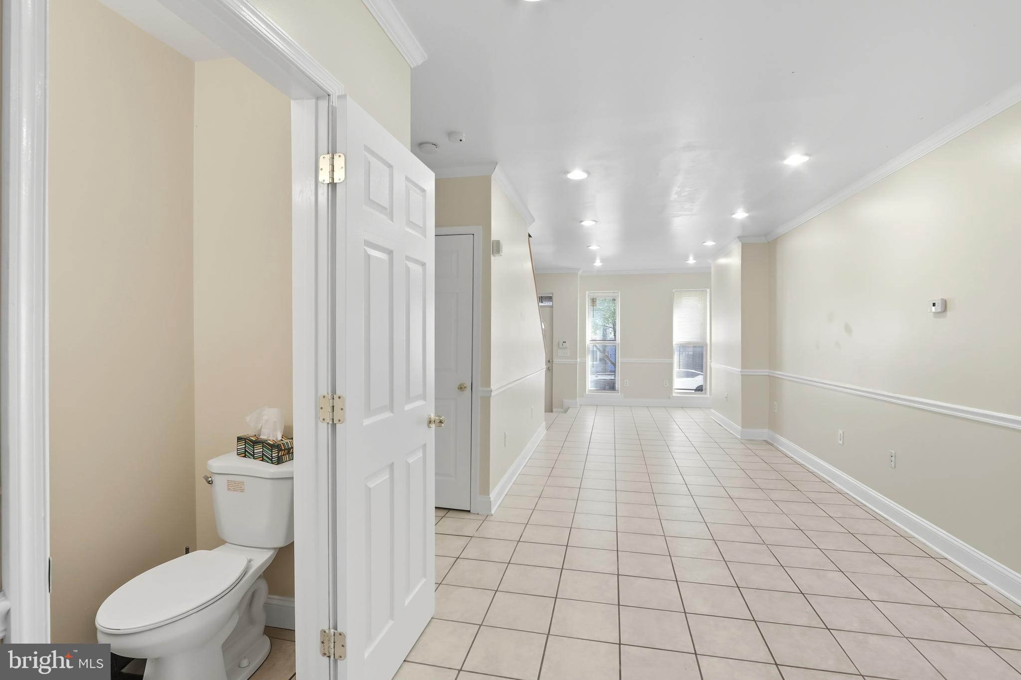 1314 James Street Baltimore, MD 21223 - Photo 7 of 19 a bathroom with a sink a toilet a mirror and shower