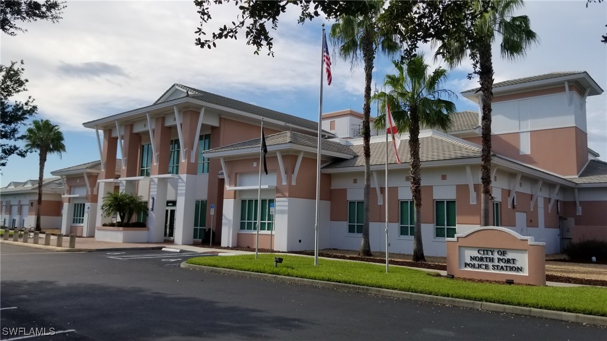1127226126 Largeleaf Street North Port, FL 34288 - Photo 11 of 43 a front view of a house with a garden and plants