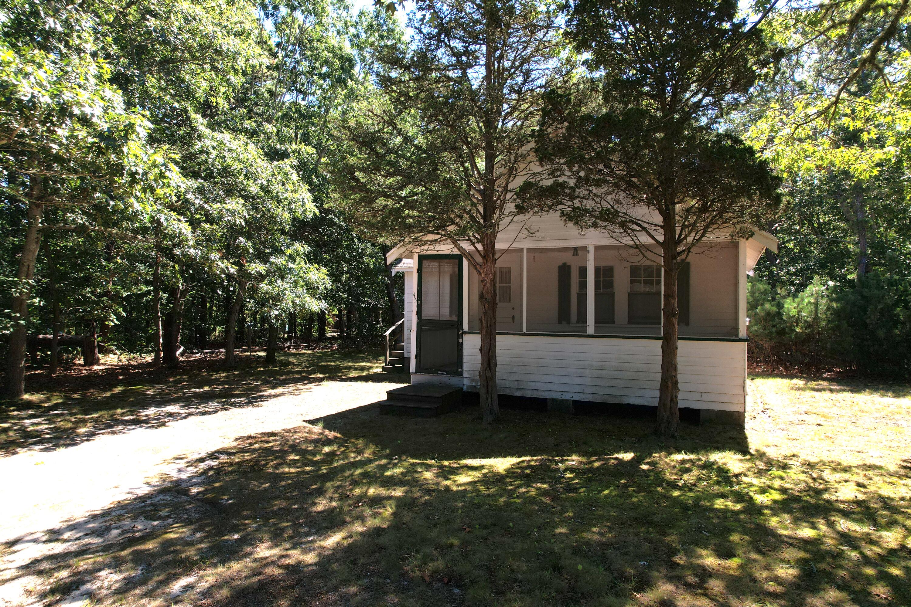 a view of a house with a large tree