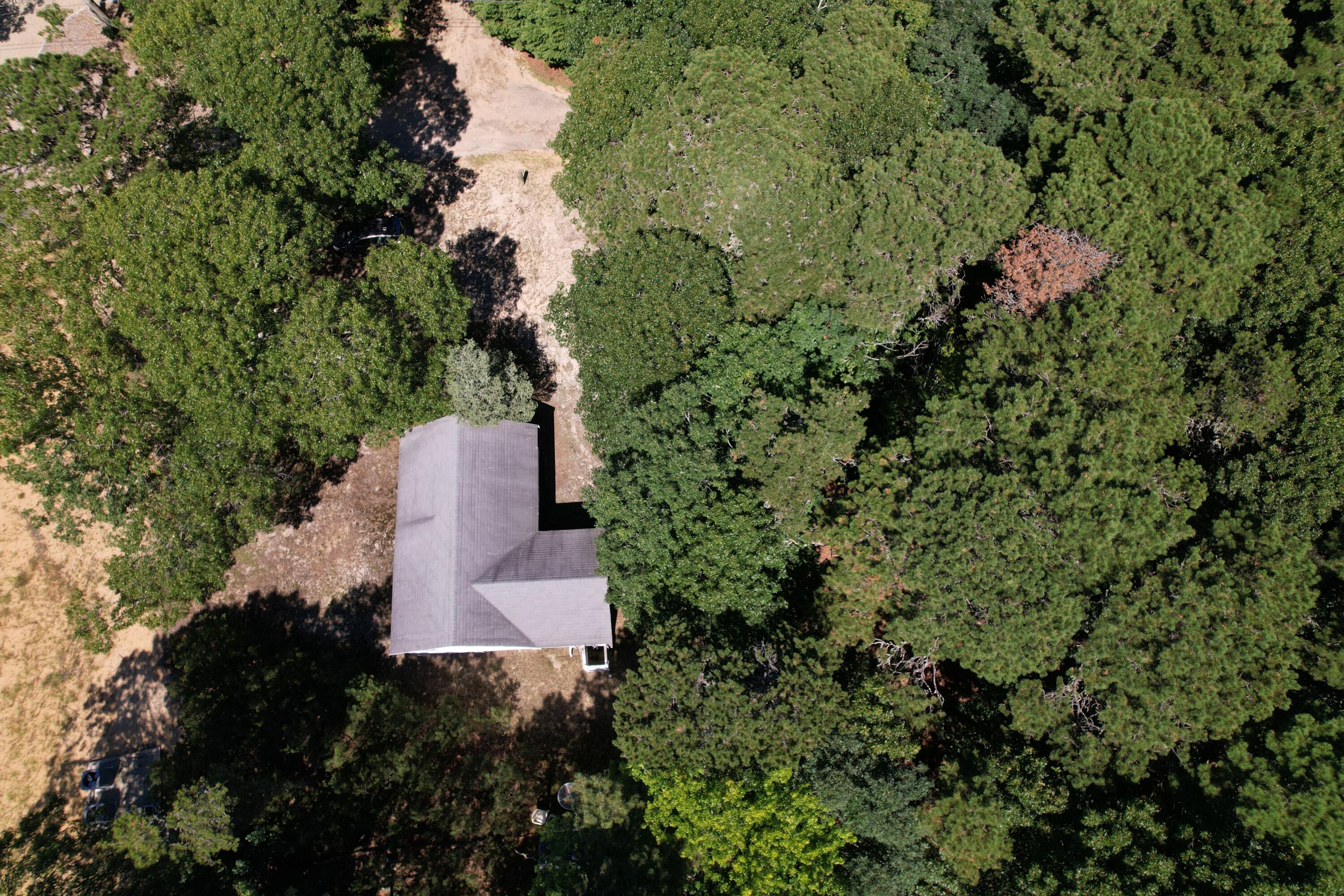 45 Swift Road Eastham, MA 02642 - Photo 11 of 24 an aerial view of residential house with outdoor space and trees all around
