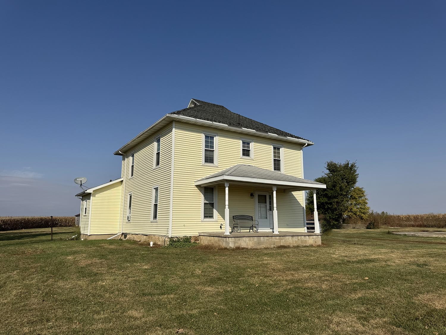 27375 Highway 40 Chadwick, IL 61014 - Photo 1 of 39 a front view of a house with a garden