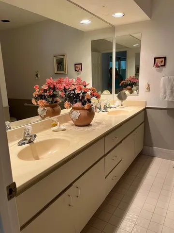a bathroom with a sink double vanity and a mirror