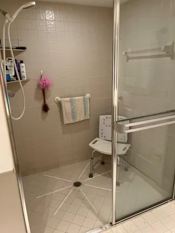 a bathroom with a sink mirror and toilet