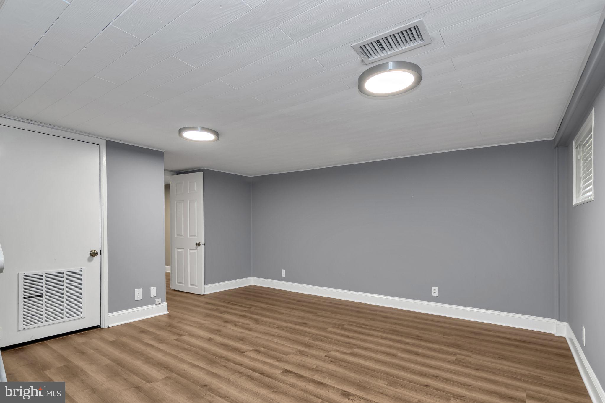 4237 32nd Road South Arlington, VA 22206 - Photo 17 of 49 a view of an empty room with wooden floor and a window