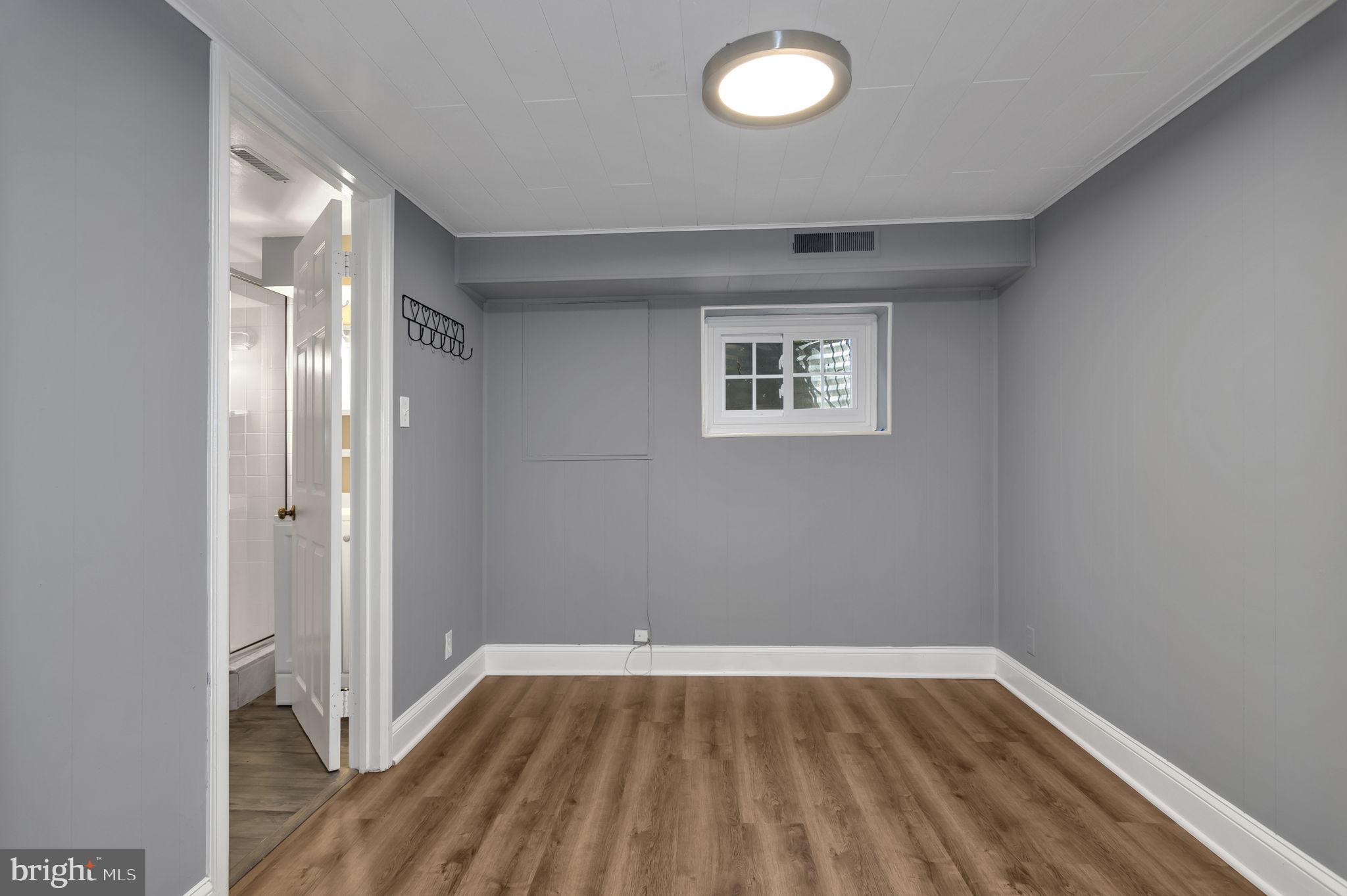 4237 32nd Road South Arlington, VA 22206 - Photo 20 of 49 an empty room with wooden floor and windows