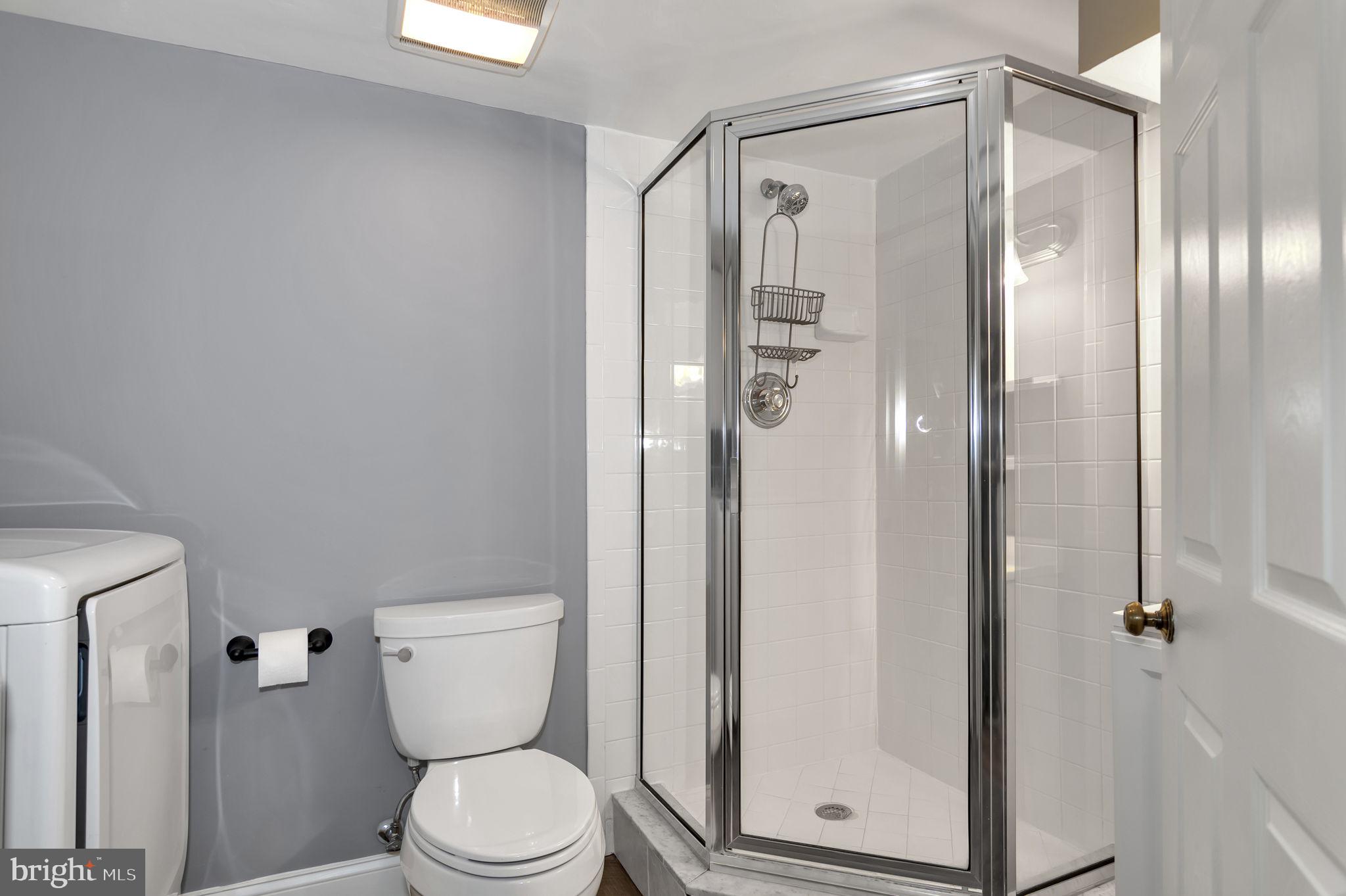 4237 32nd Road South Arlington, VA 22206 - Photo 24 of 49 a bathroom with a toilet and a glass door