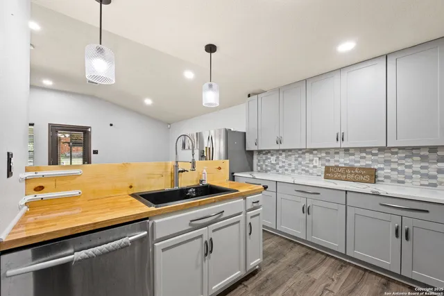 a kitchen with sink cabinets and window