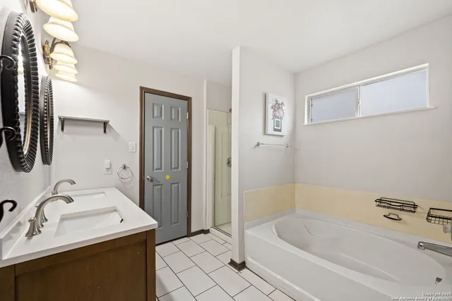 a bathroom with a sink a bathtub and a shower