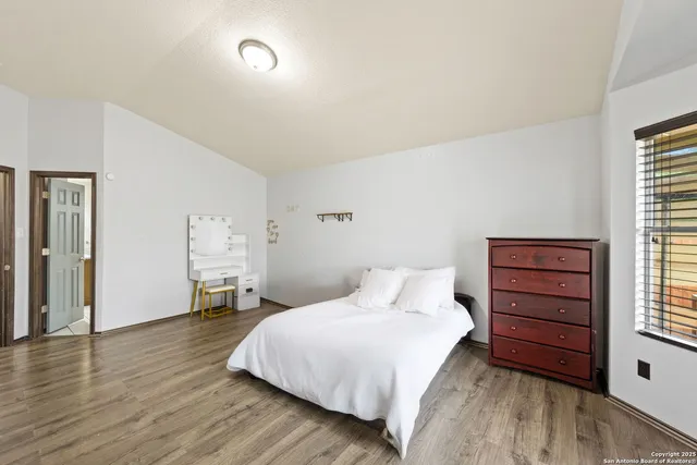 a bedroom with a bed and a dresser