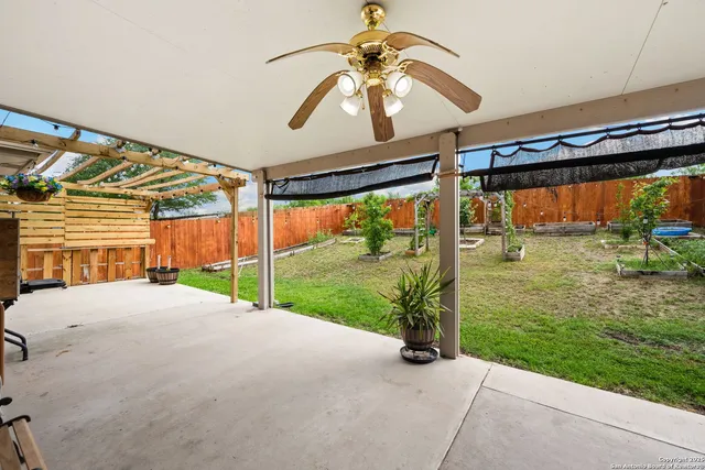 a view of a house with a yard and porch