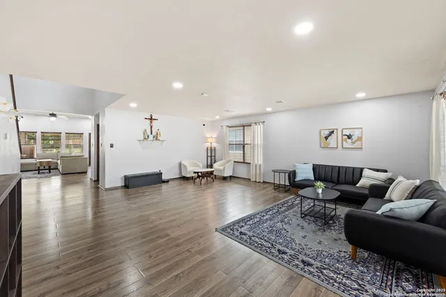 a living room with furniture and a table