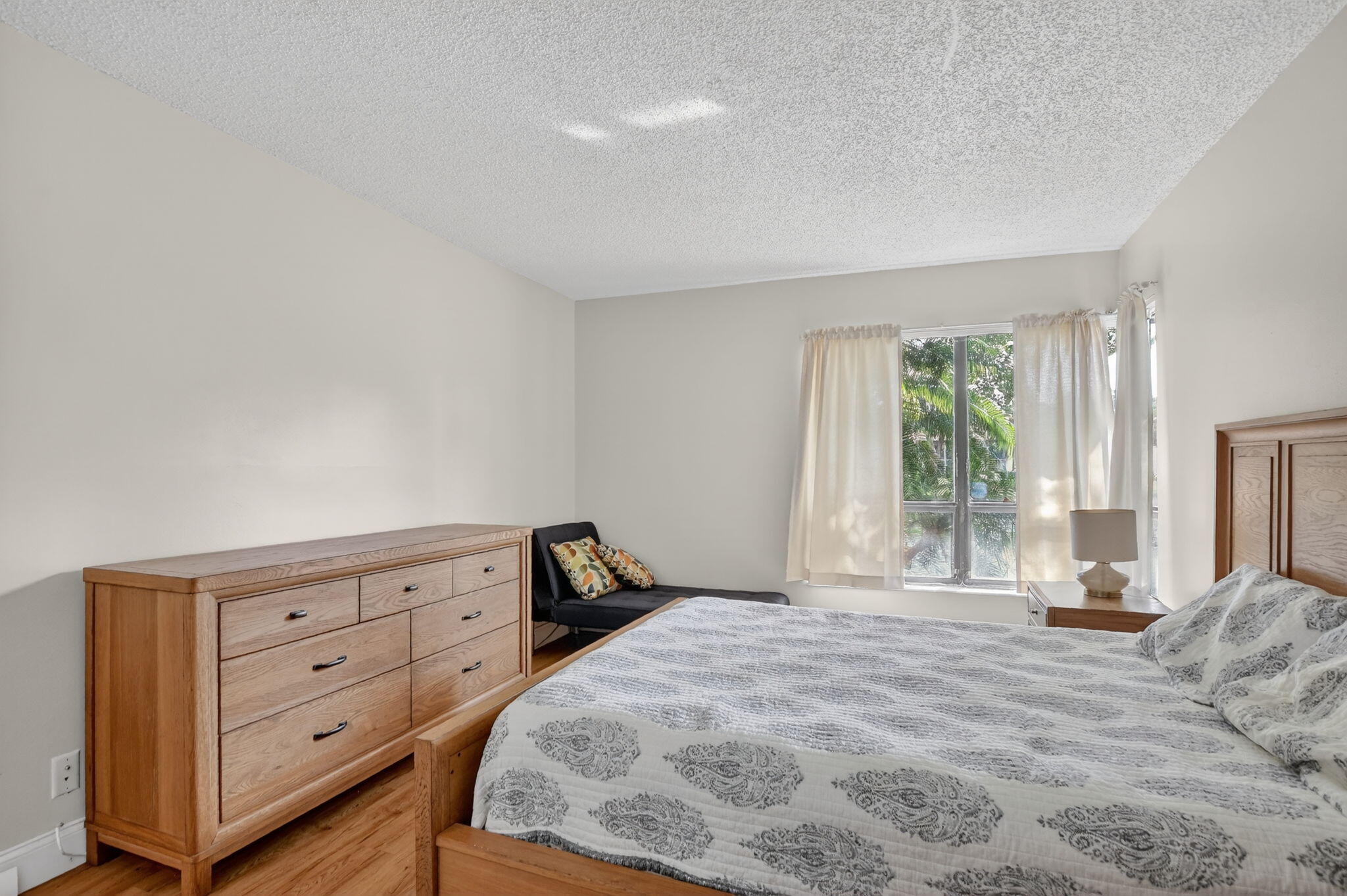 2297 Southwest 15th Street, Unit 127 Deerfield Beach, FL 33442 - Photo 16 of 39 a bedroom with a bed and a window