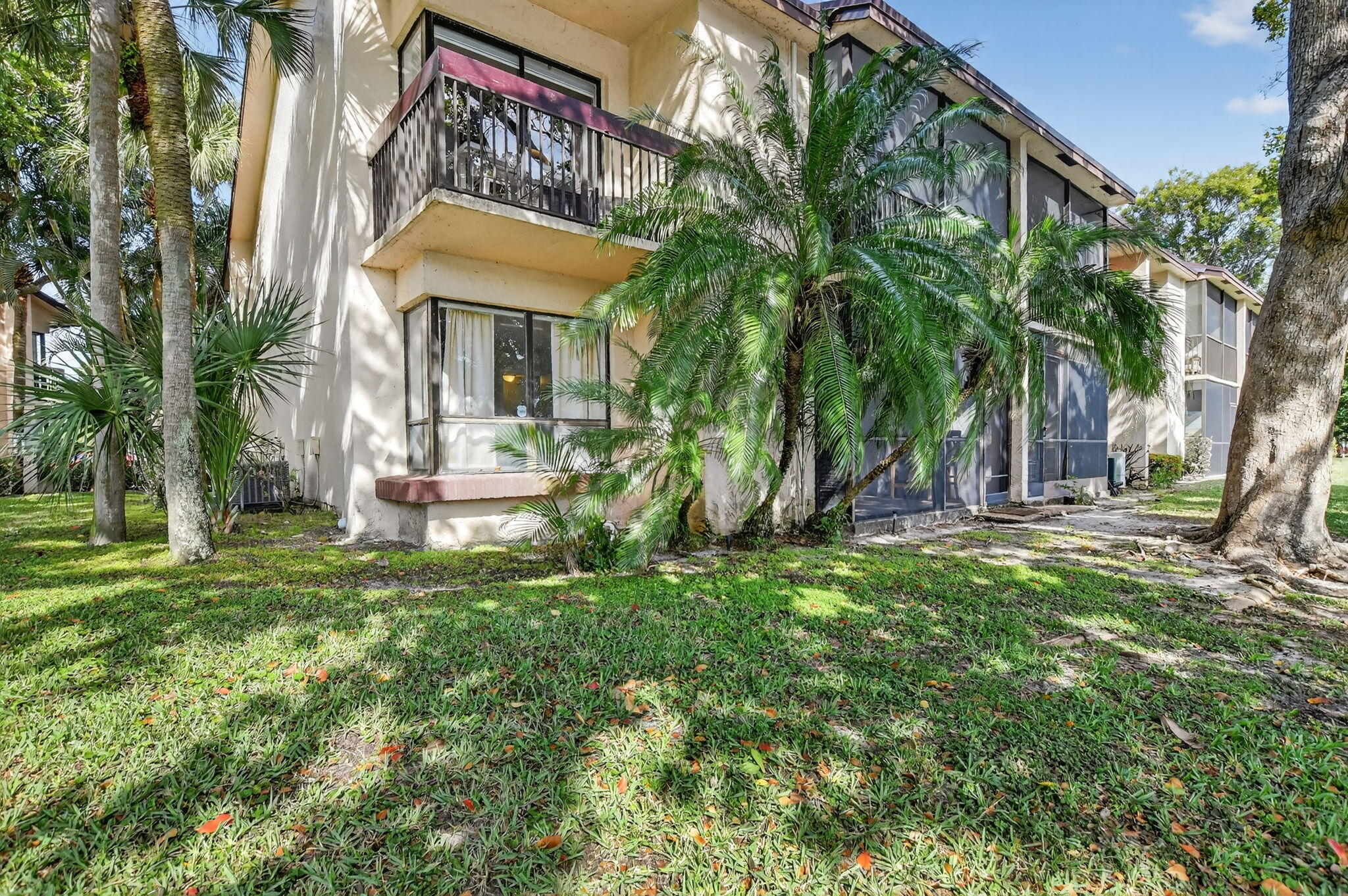 2297 Southwest 15th Street, Unit 127 Deerfield Beach, FL 33442 - Photo 29 of 39 a view of a house with a yard
