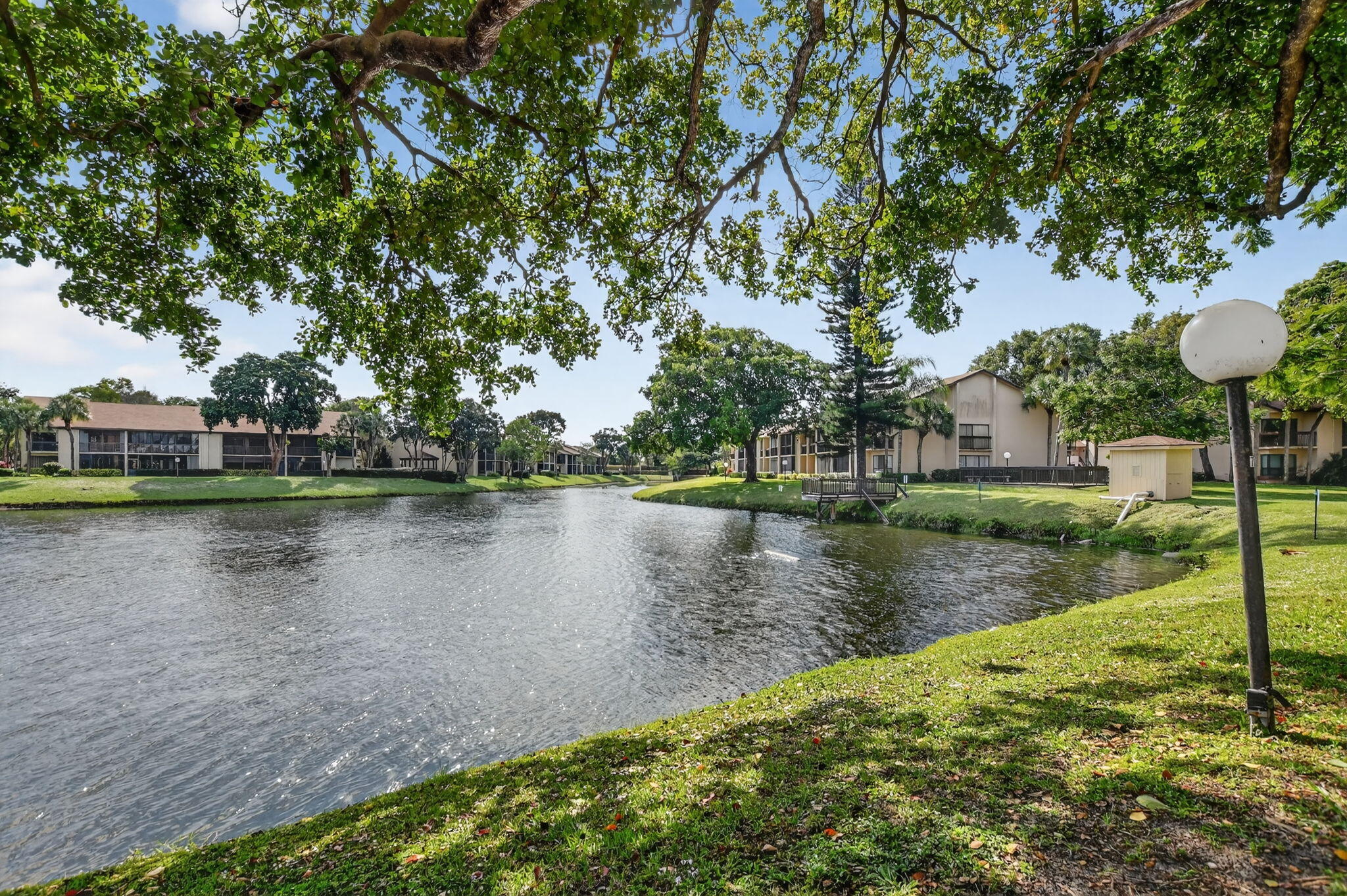 2297 Southwest 15th Street, Unit 127 Deerfield Beach, FL 33442 - Photo 32 of 39 a view of a lake with houses