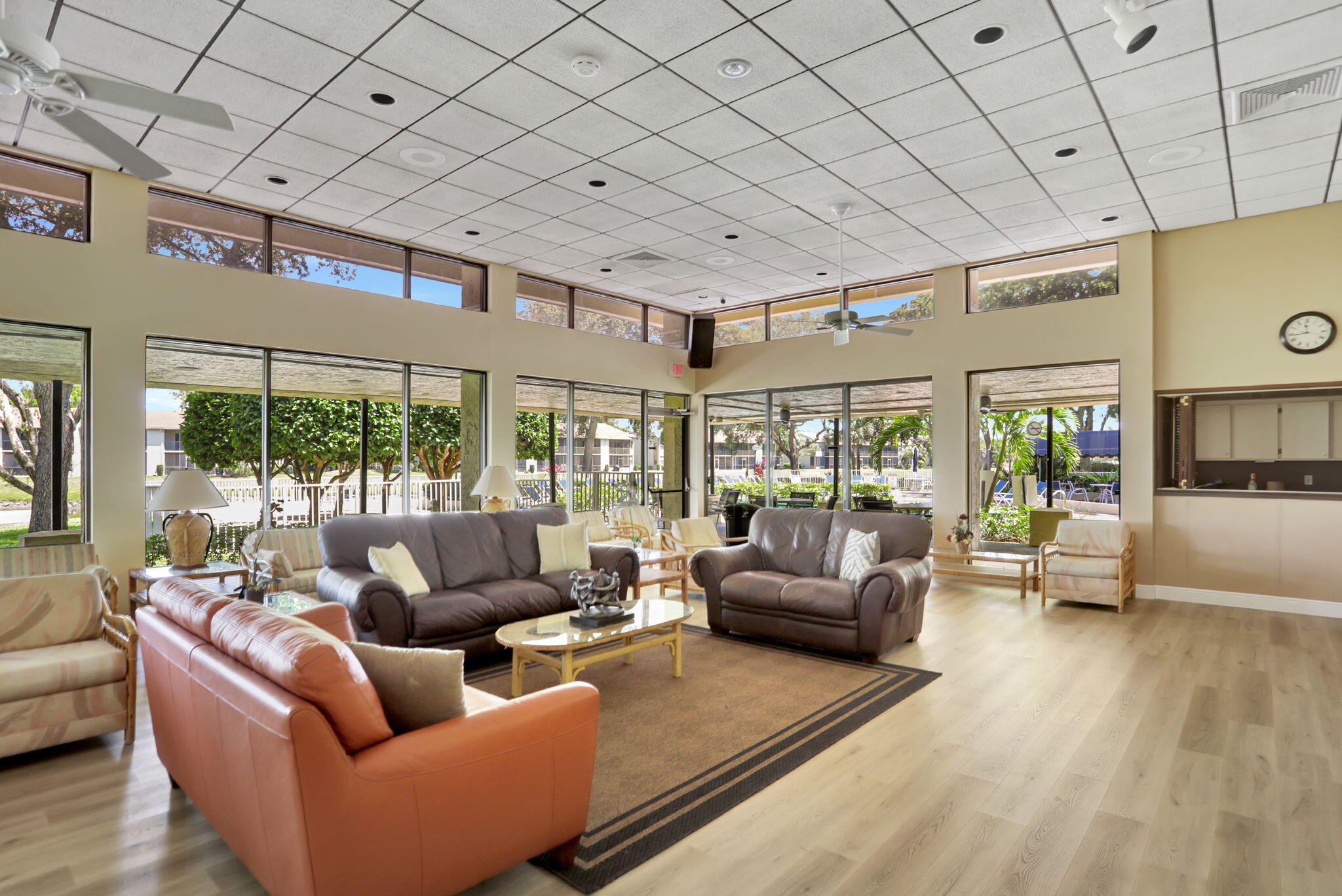 2297 Southwest 15th Street, Unit 127 Deerfield Beach, FL 33442 - Photo 37 of 39 a living room with furniture and a large window