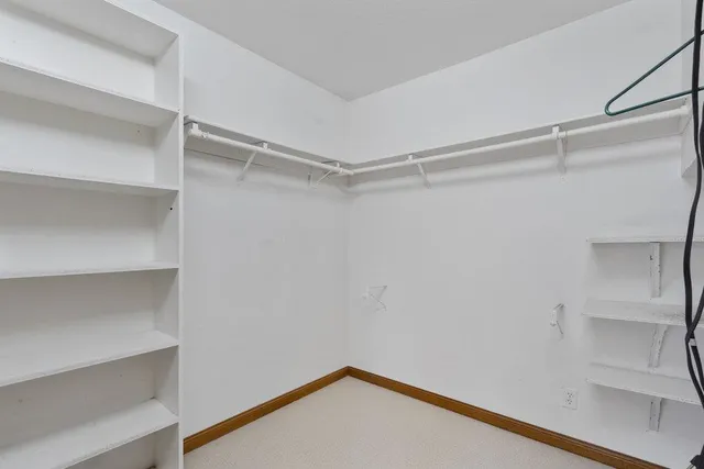 a view of an empty walk in closet
