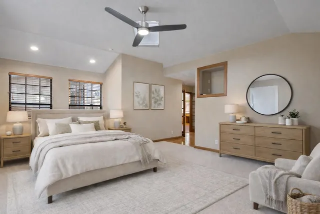 a bedroom with a bed and a dresser