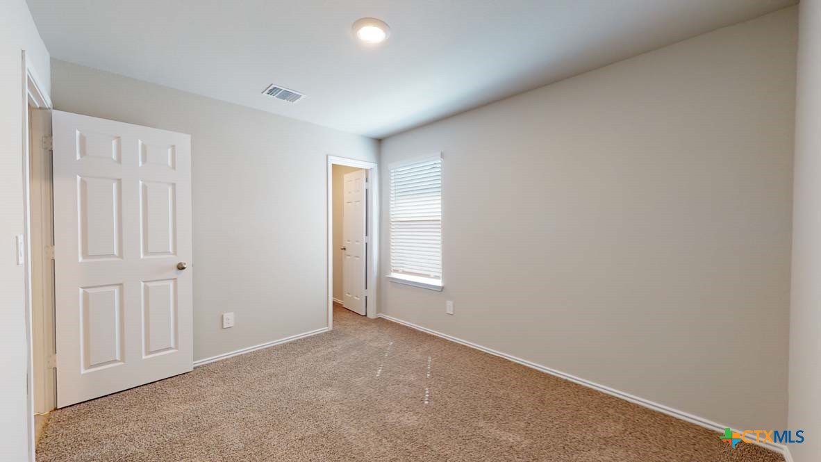 549 Hector Loop Georgetown, TX 78626 - Photo 21 of 22 a view of an empty room and window