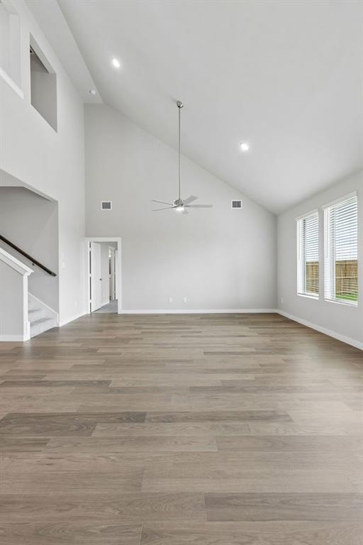 1121 Del Rio Drive Lavon, TX 75166 - Photo 9 of 32 an empty room with wooden floor and windows