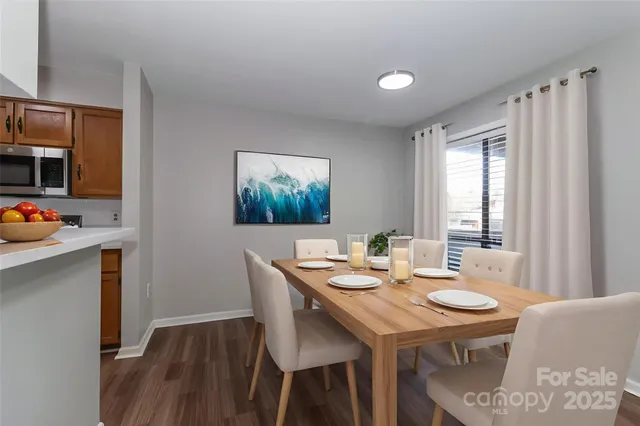 a view of a dining table and chairs in a room