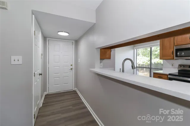 a kitchen with sink cabinets and outdoor view