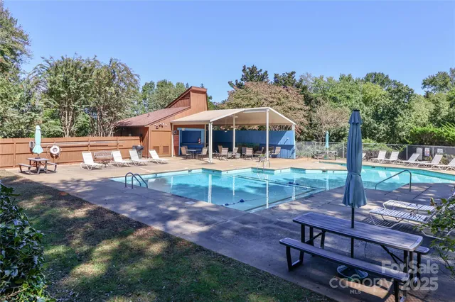 a view of a house with backyard porch and sitting area