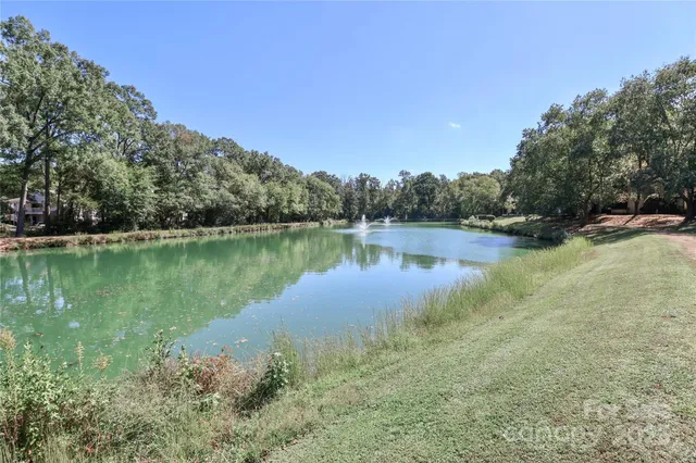 a view of a lake in between the two and trees