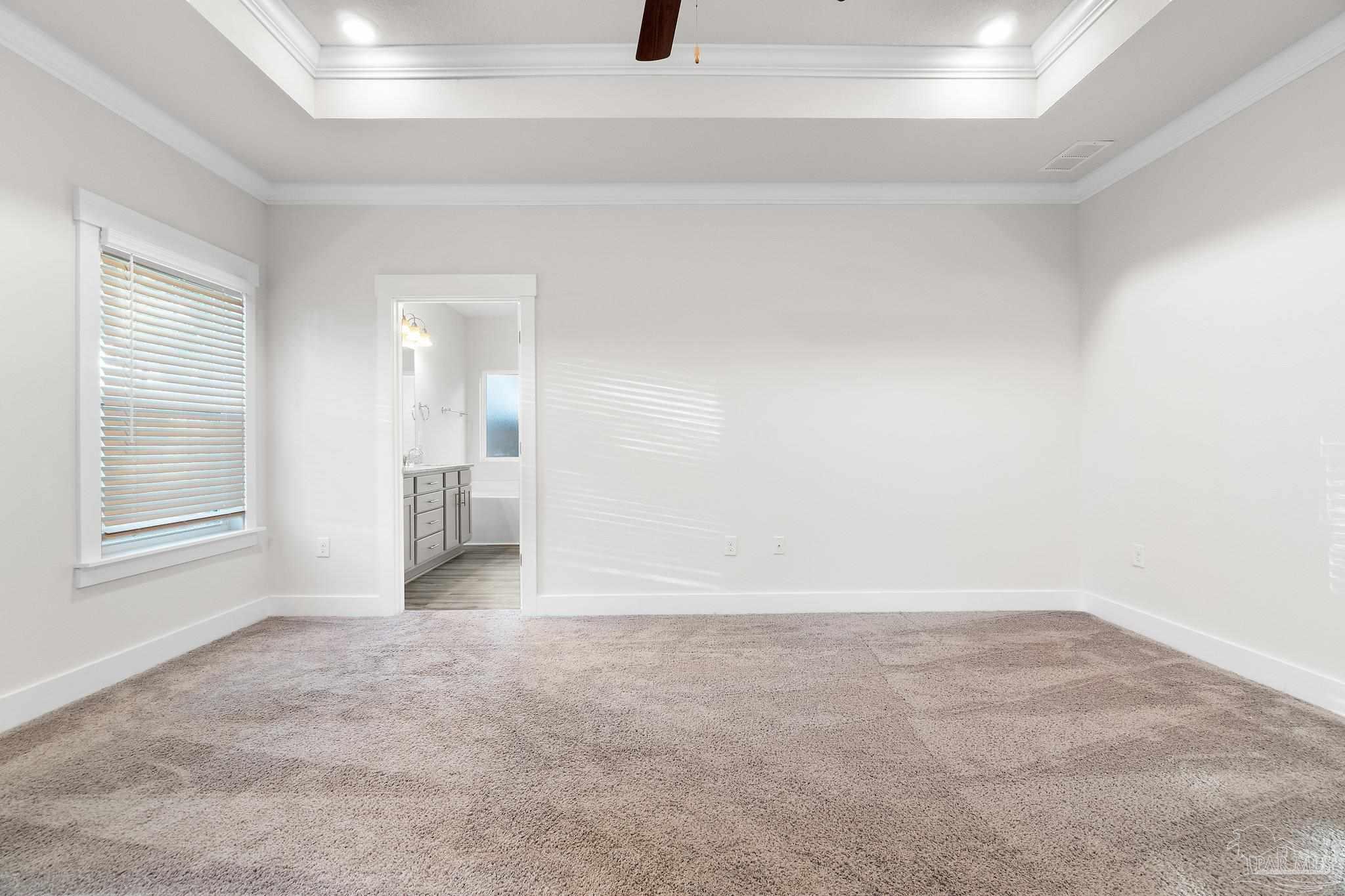 4527 Jude Way Pace, FL 32571 - Photo 21 of 38 wooden floor in an empty room with a window