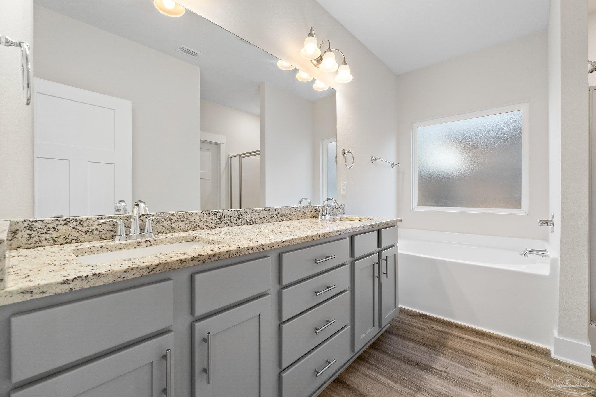 4527 Jude Way Pace, FL 32571 - Photo 22 of 38 a bathroom with a granite countertop sink mirror and a