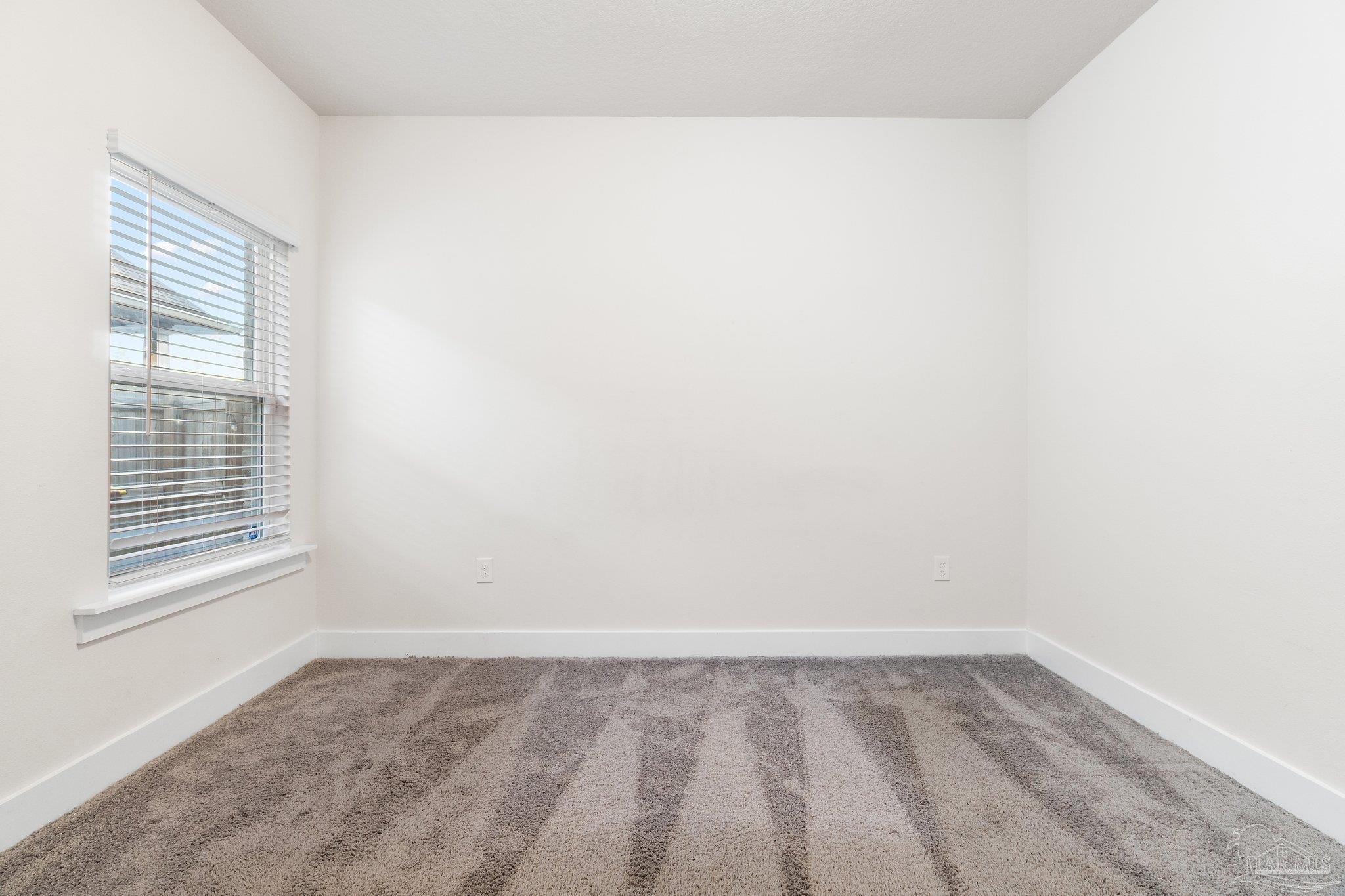 4527 Jude Way Pace, FL 32571 - Photo 26 of 38 a view of a room that has a window in it