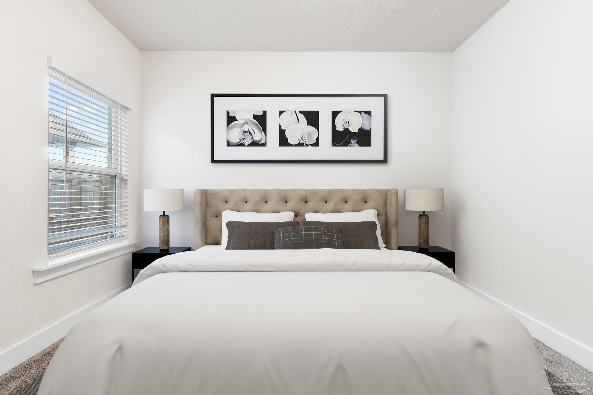 4527 Jude Way Pace, FL 32571 - Photo 27 of 38 a bedroom with a large bed and a window