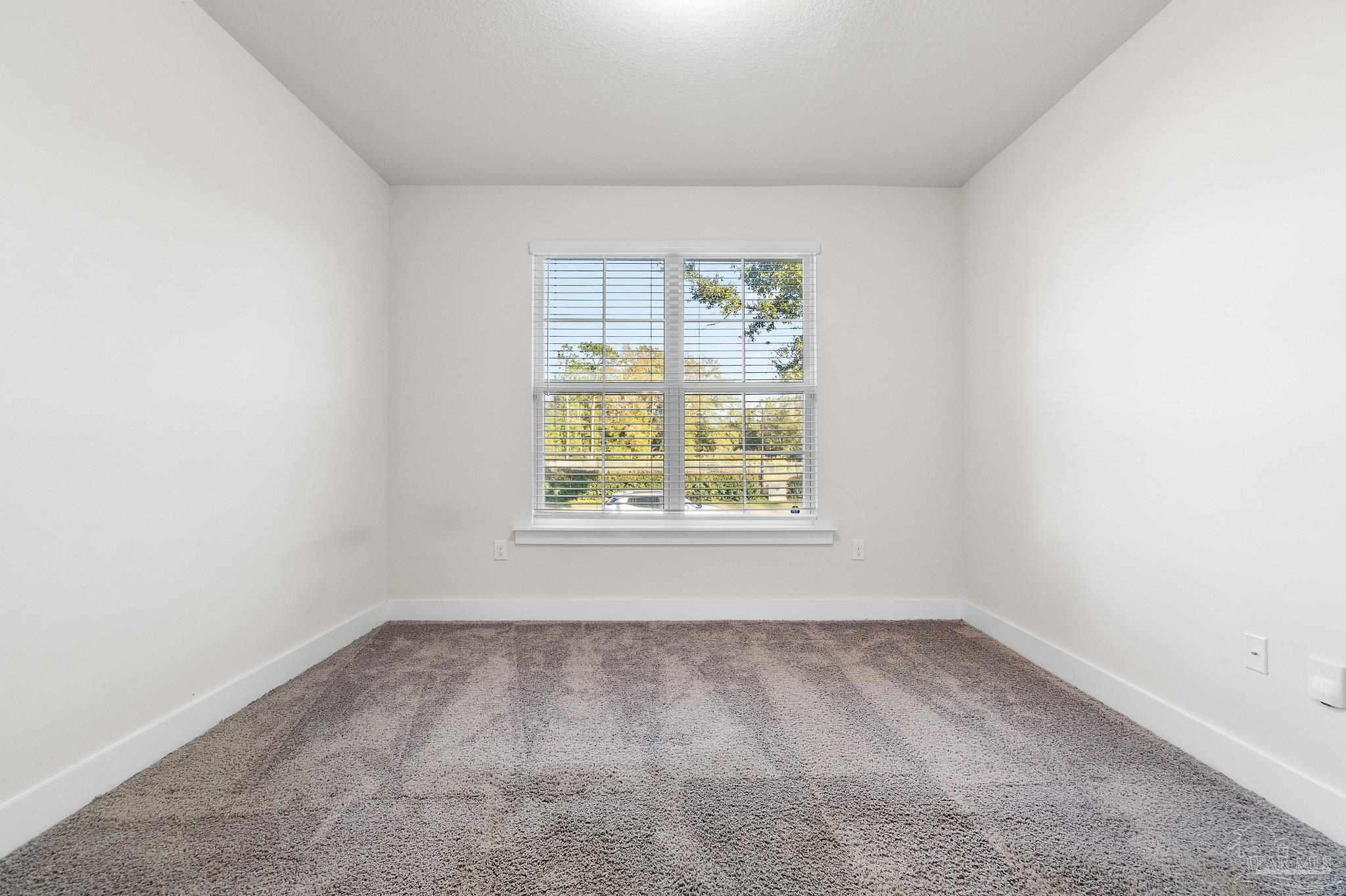 4527 Jude Way Pace, FL 32571 - Photo 29 of 38 an empty room with a window