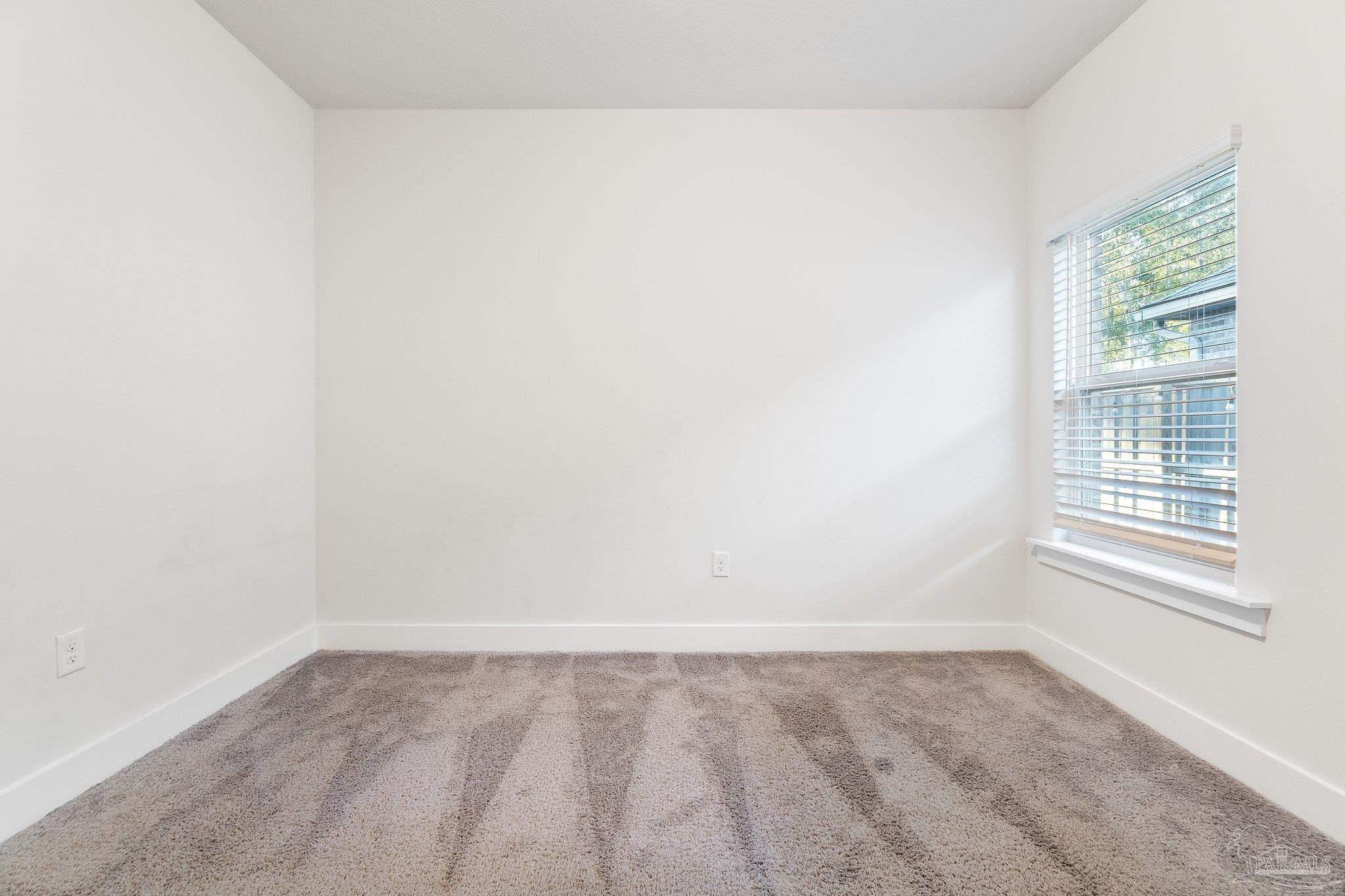 4527 Jude Way Pace, FL 32571 - Photo 34 of 38 a view of a room that has a window in it