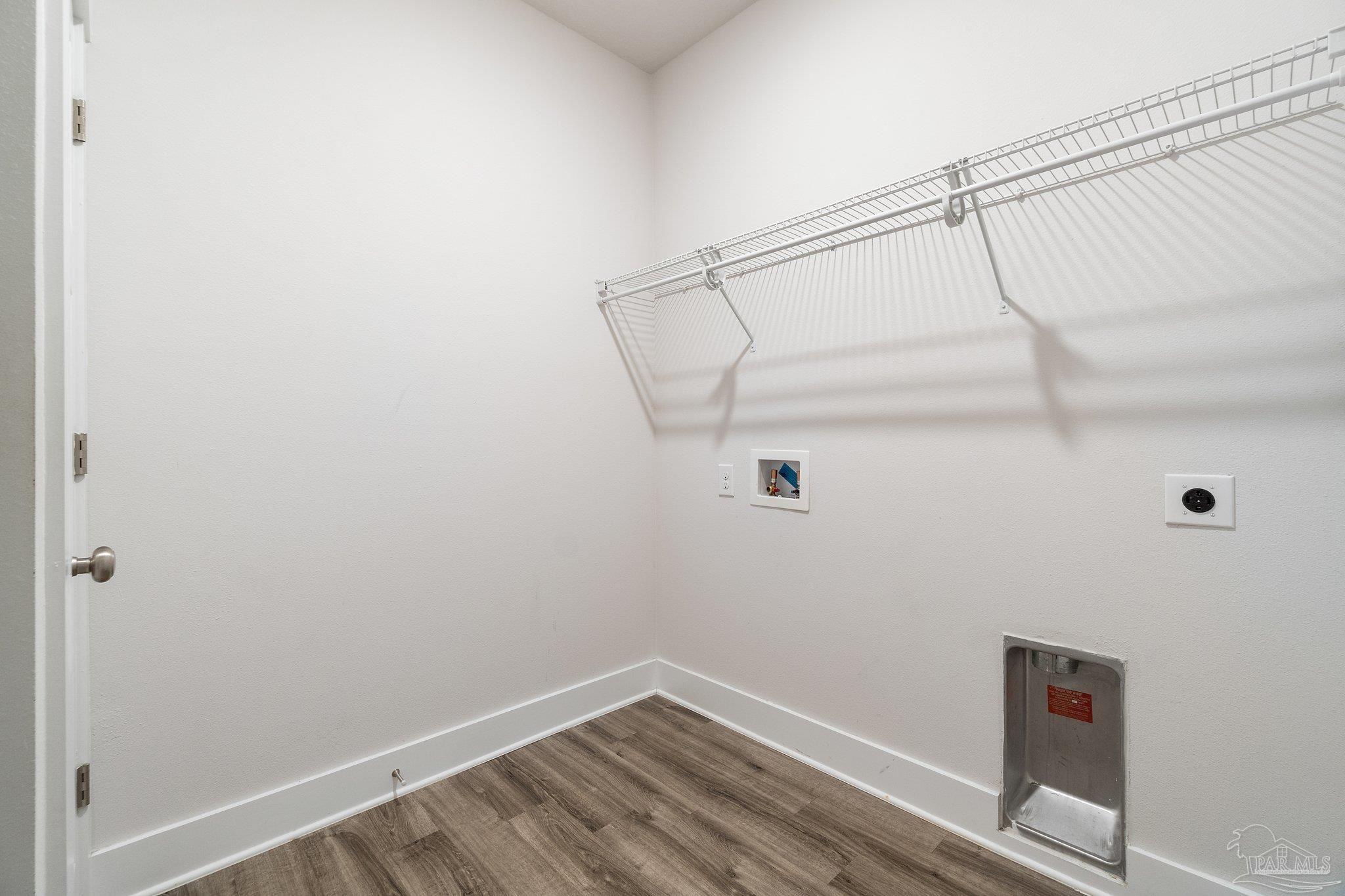 4527 Jude Way Pace, FL 32571 - Photo 36 of 38 a view of a room with racks on the wall