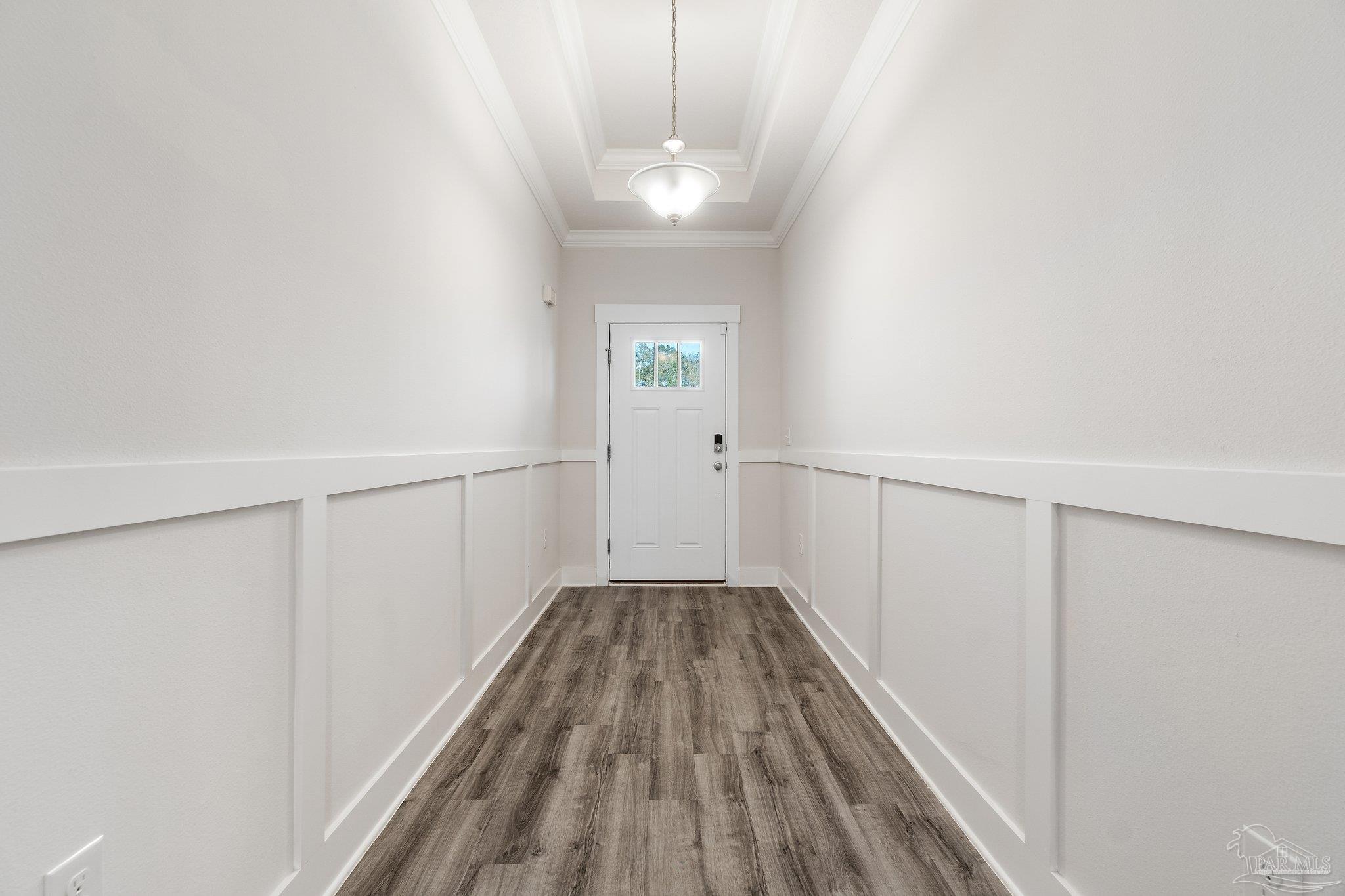 4527 Jude Way Pace, FL 32571 - Photo 4 of 38 a view of a hallway with wooden floor and staircase