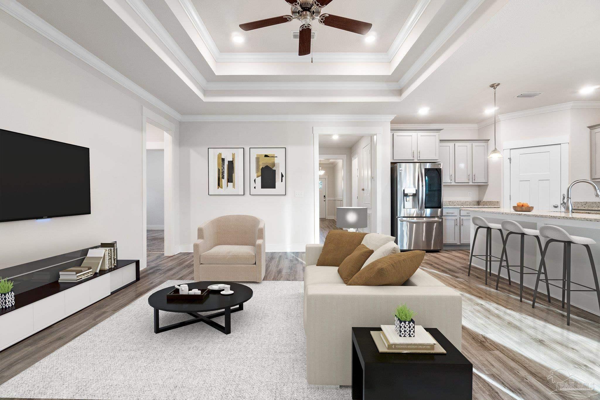 4527 Jude Way Pace, FL 32571 - Photo 8 of 38 a living room with furniture and a flat screen tv