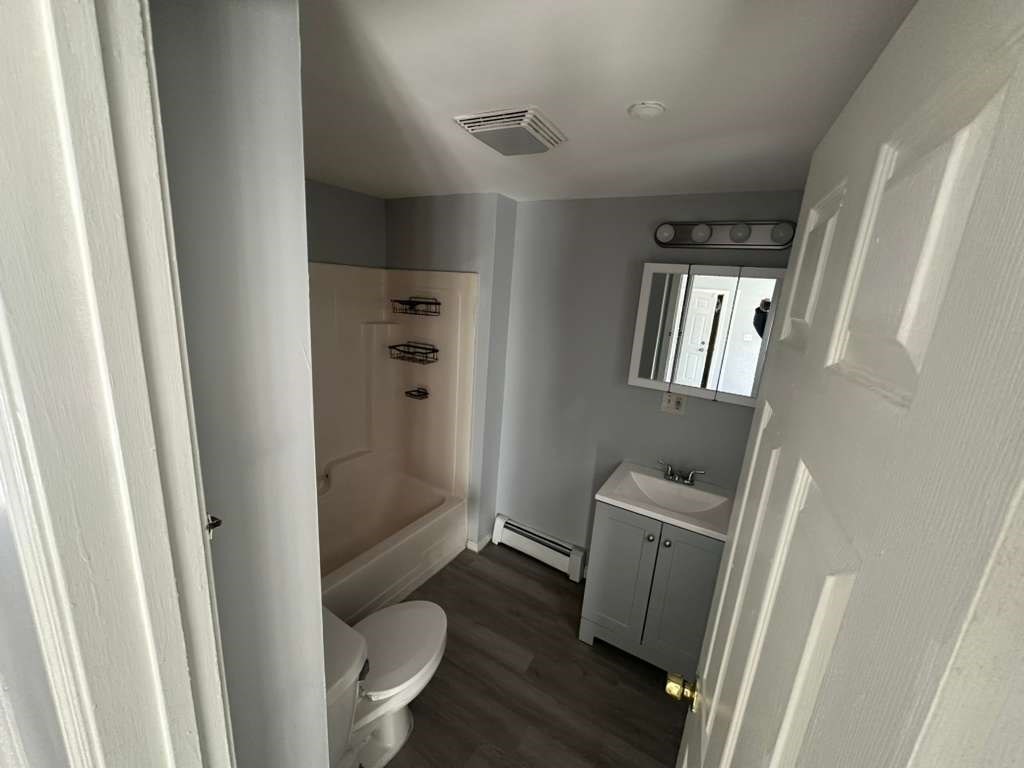 27 Willow Street, Unit A Lawrence, MA 01841 - Photo 11 of 29 a bathroom with a sink and toilet
