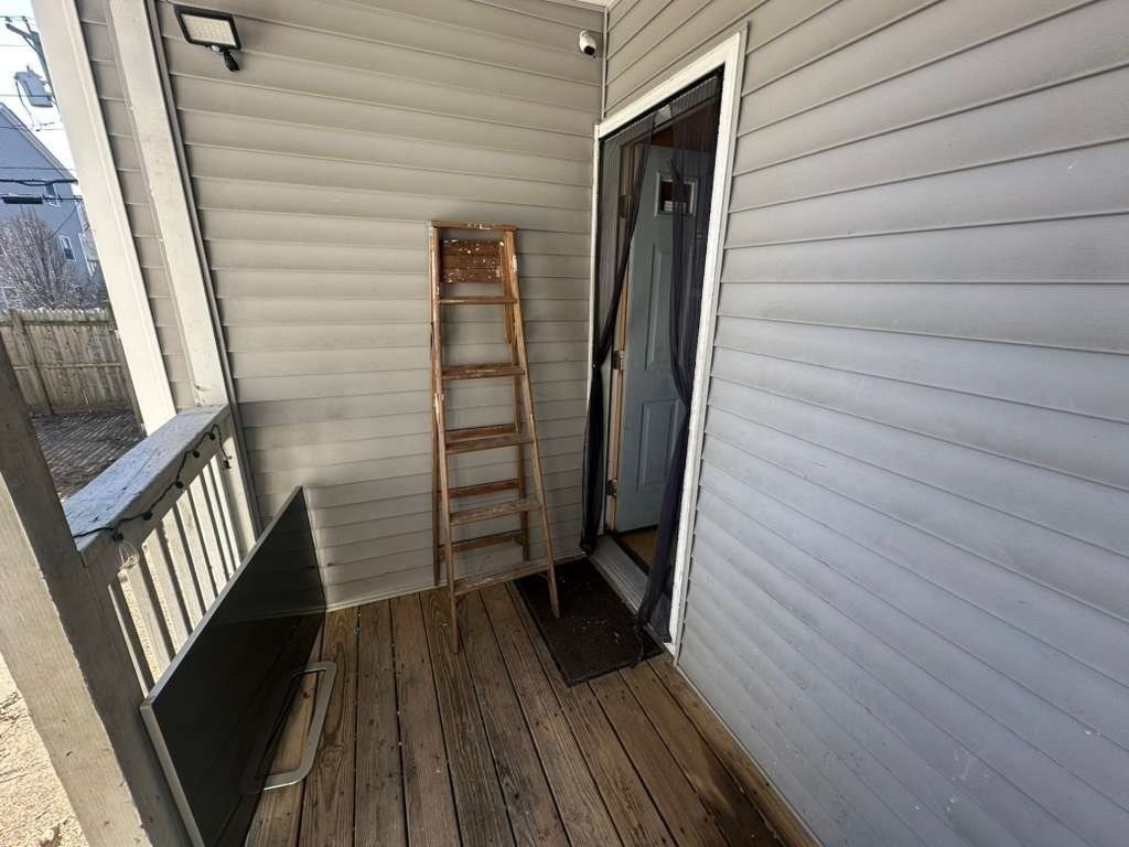 27 Willow Street, Unit A Lawrence, MA 01841 - Photo 19 of 29 a view of wooden floor in an empty room