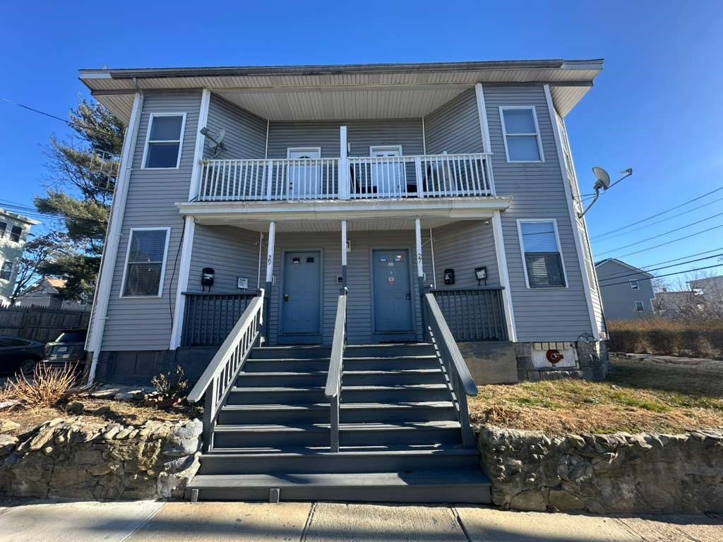 27 Willow Street, Unit A Lawrence, MA 01841 - Photo 2 of 29 a view of a house with more windows and wooden fence