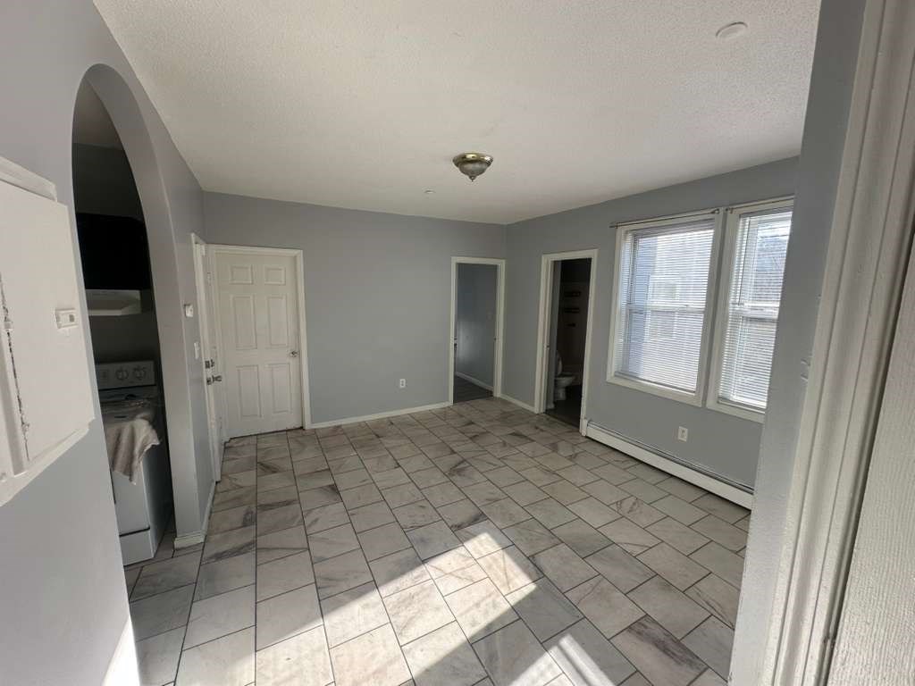 27 Willow Street, Unit A Lawrence, MA 01841 - Photo 6 of 29 a view of an empty room and window