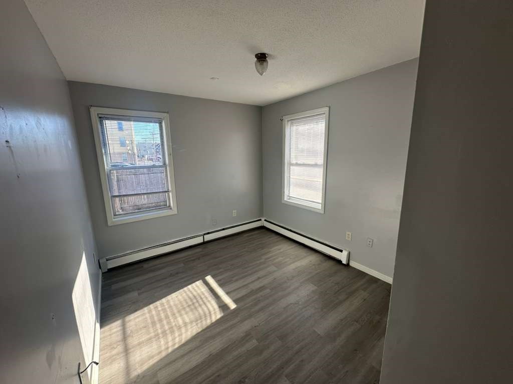27 Willow Street, Unit A Lawrence, MA 01841 - Photo 7 of 29 a view of an empty room and window