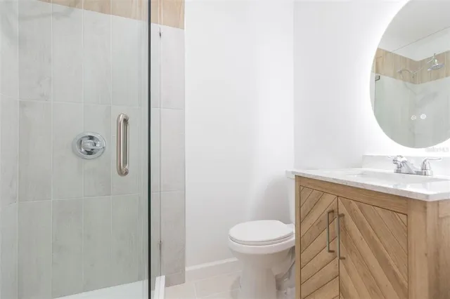 a bathroom with a toilet and shower
