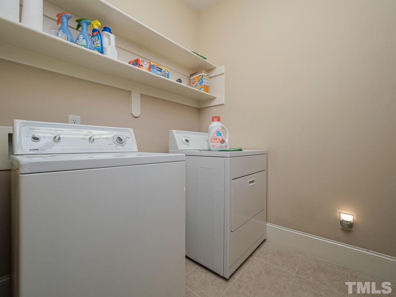 1217 Colonial Club Road Wake Forest, NC 27587 - Photo 16 of 30 This first floor laundry room features a utility sink too!!