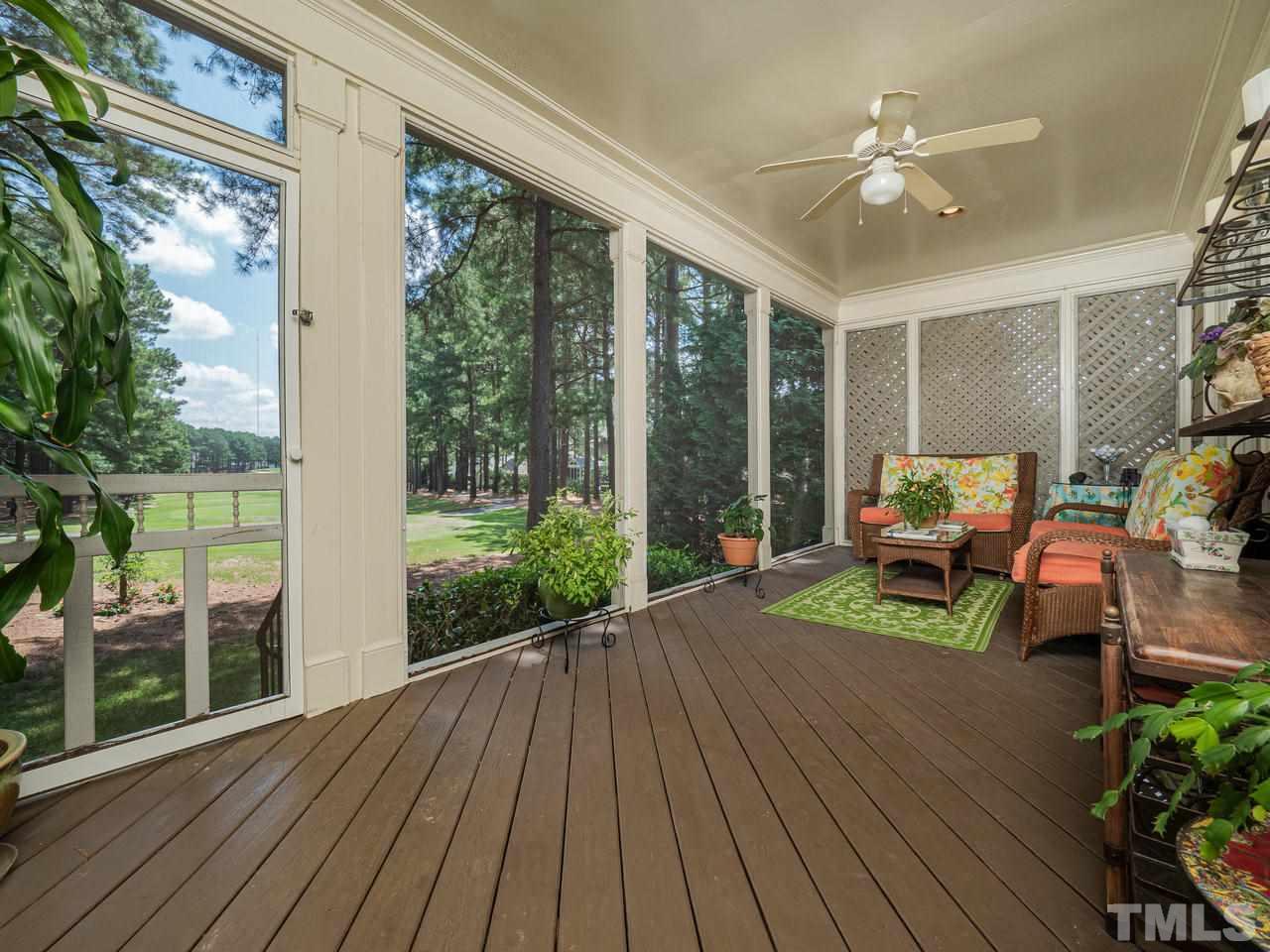 1217 Colonial Club Road Wake Forest, NC 27587 - Photo 25 of 30 Gracious living right here on this screened porch! If you have always dreamed on living on a golf course, then it's time to make your dreams come true!